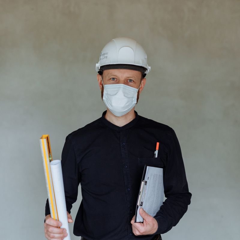 Male structural inspector assessing commercial office structure