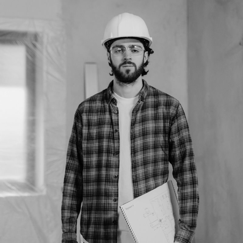 Male construction inspector checking commercial structure columns